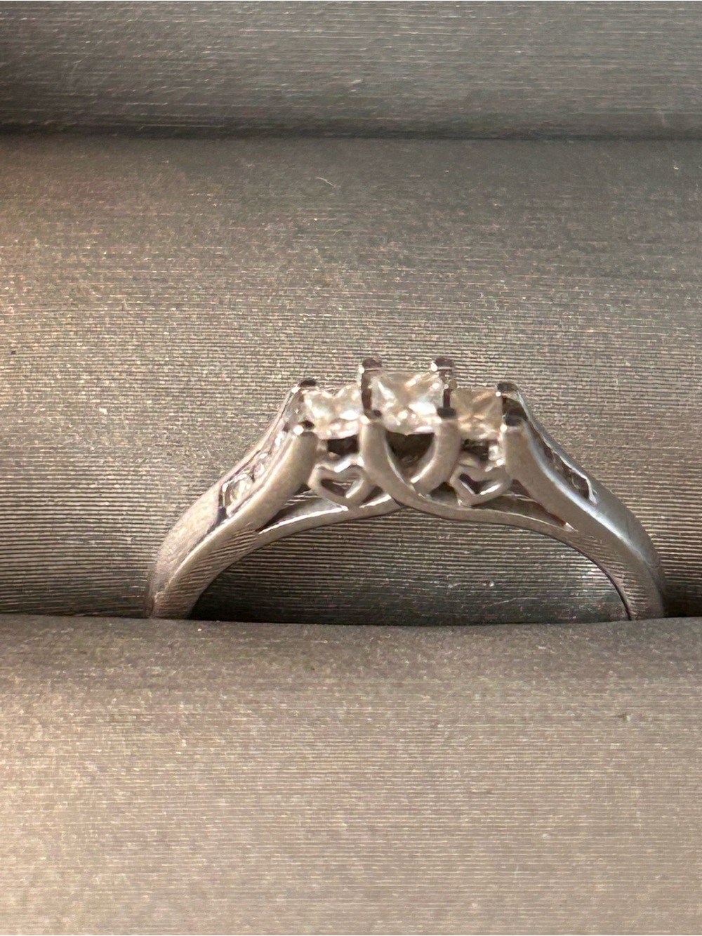 10K White Gold Ring 1/4 Ct princess cut 
3 main stones, purchased from Zales 6